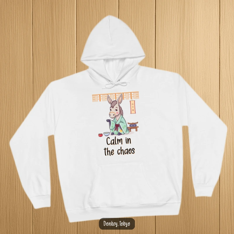 Funny, cozy hoodie with a cheerful donkey in a flowing kimono, practicing a tea ceremony, exuding peaceful vibes.
