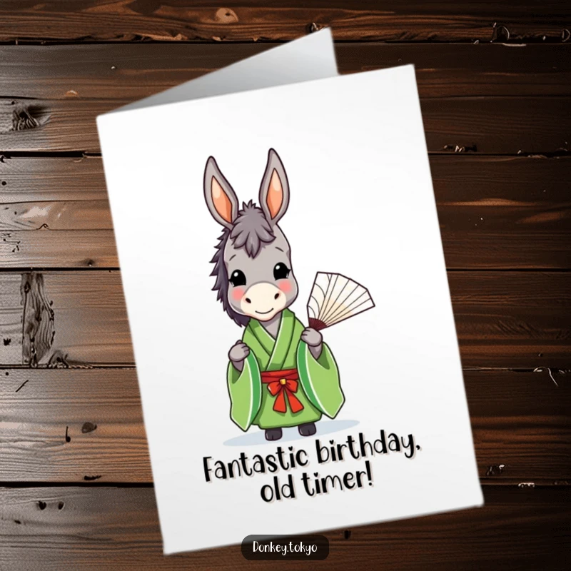 Funny Free Printable Birthday Card featuring a donkey in a green kimono holding a fan with a gentle smile.